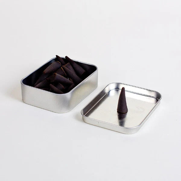Indulge in the rich aromas of Big Bend National Park with Good &amp;amp; Well Supply Co's hand-dipped incense cones. Encased in a robust aluminum tin, these cones are thoughtfully designed, with the lid serving as a convenient burning surface. With notes of charred wood, amber, smoky embers, and spice, you'll be transported to an evening camping in Big Bend.&amp;nbsp;
