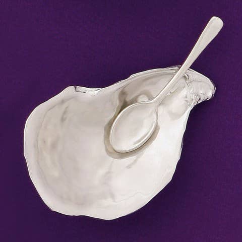 This salt cellar, shaped like an oyster shell, will add a dash of style and whimsy to your table. Includes a miniature spoon for perfectly sprinkling spices. You'll want to keep this salt cellar out on your table full-time. The days of salt being banished to the spice cabinet is behind you! Fine hand-crafted pewter, made in Canada.