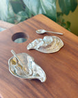 This salt cellar, shaped like an oyster shell, will add a dash of style and whimsy to your table. Includes a miniature spoon for perfectly sprinkling spices. You'll want to keep this salt cellar out on your table full-time. The days of salt being banished to the spice cabinet is behind you! Fine hand-crafted pewter, made in Canada.