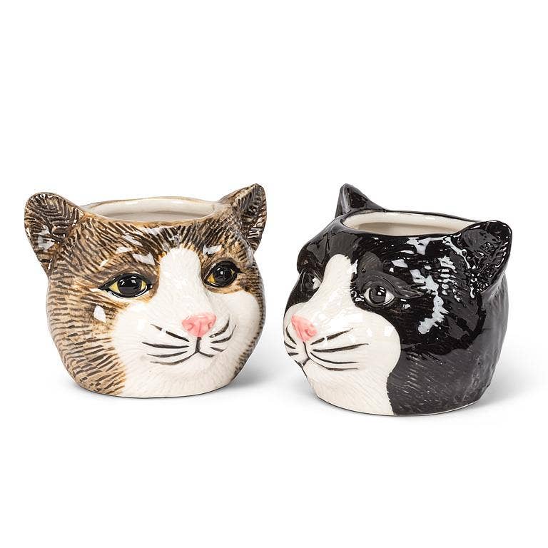 This adorable Small Black Cat Head Planter is the perfect complement to any cat lover's favorite cactus, succulent or flowers. Crafted out of ceramic, the cartoon-like shape of this cat head planter is sure to add a touch of fun and whimsy anywhere.