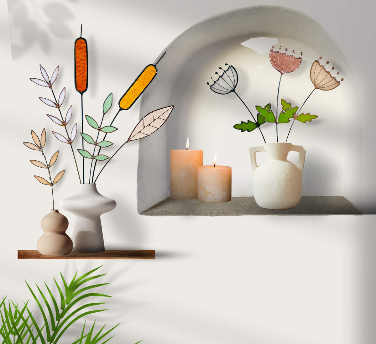 Stained glass flower stems in vases on a white shelf nook beside lit candles