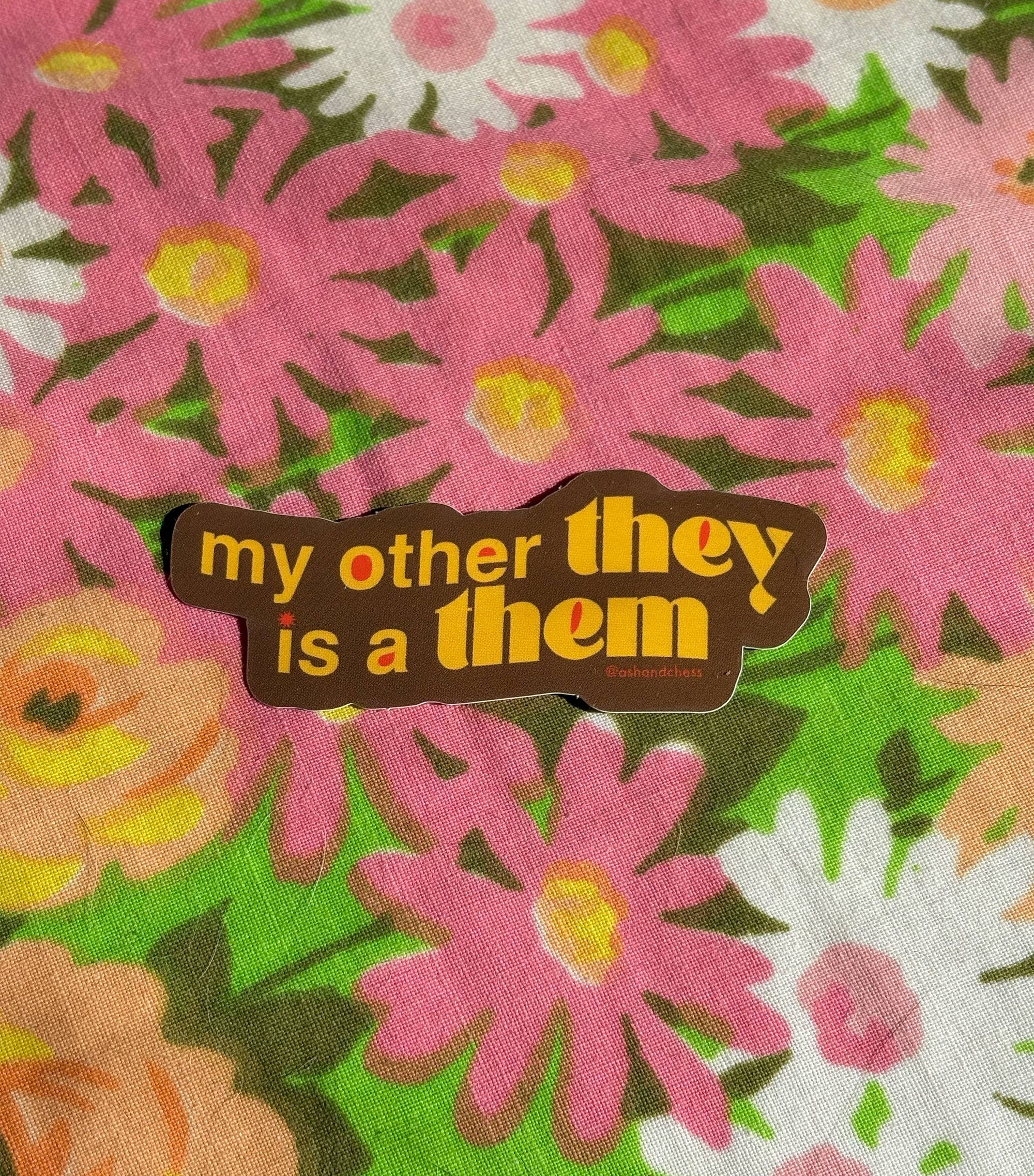 Floral pattern with a brown banner displaying text on a multicolored floral background