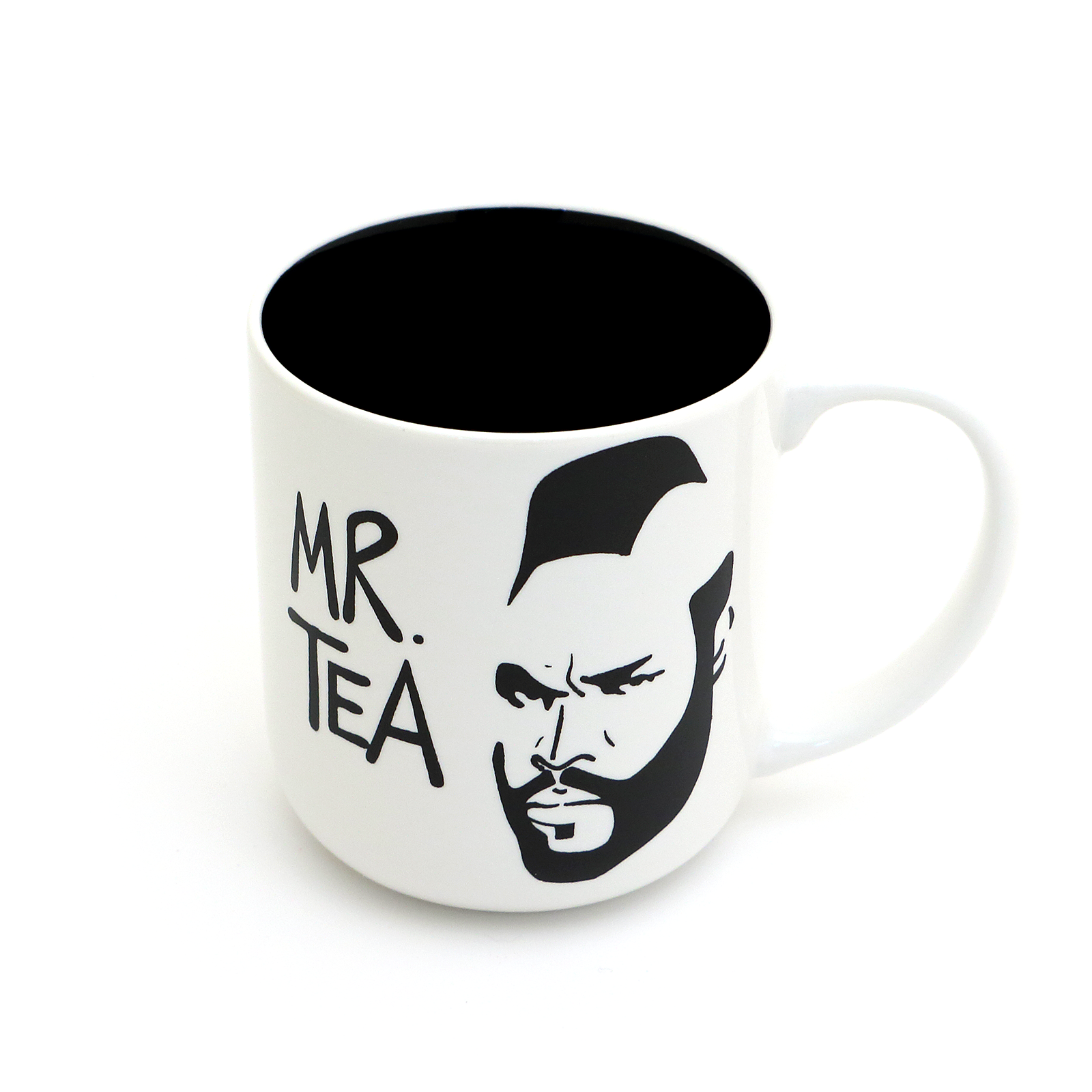 White mug with black interior, featuring a graphic of a face and 'MR. TEA' text on a white background.