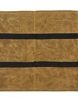 Tan waxed canvas firewood carrier laid flat on a white background