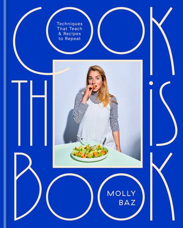 Cook This Book by Molly Baz, blue cover with a photo of Molly Baz eating a salad