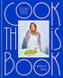 Cook This Book by Molly Baz, blue cover with a photo of Molly Baz eating a salad