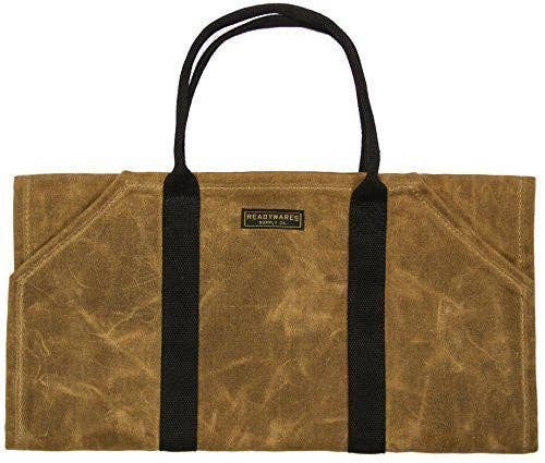 Empty tan waxed canvas firewood carrier with black webbing handles and a Readywares label
