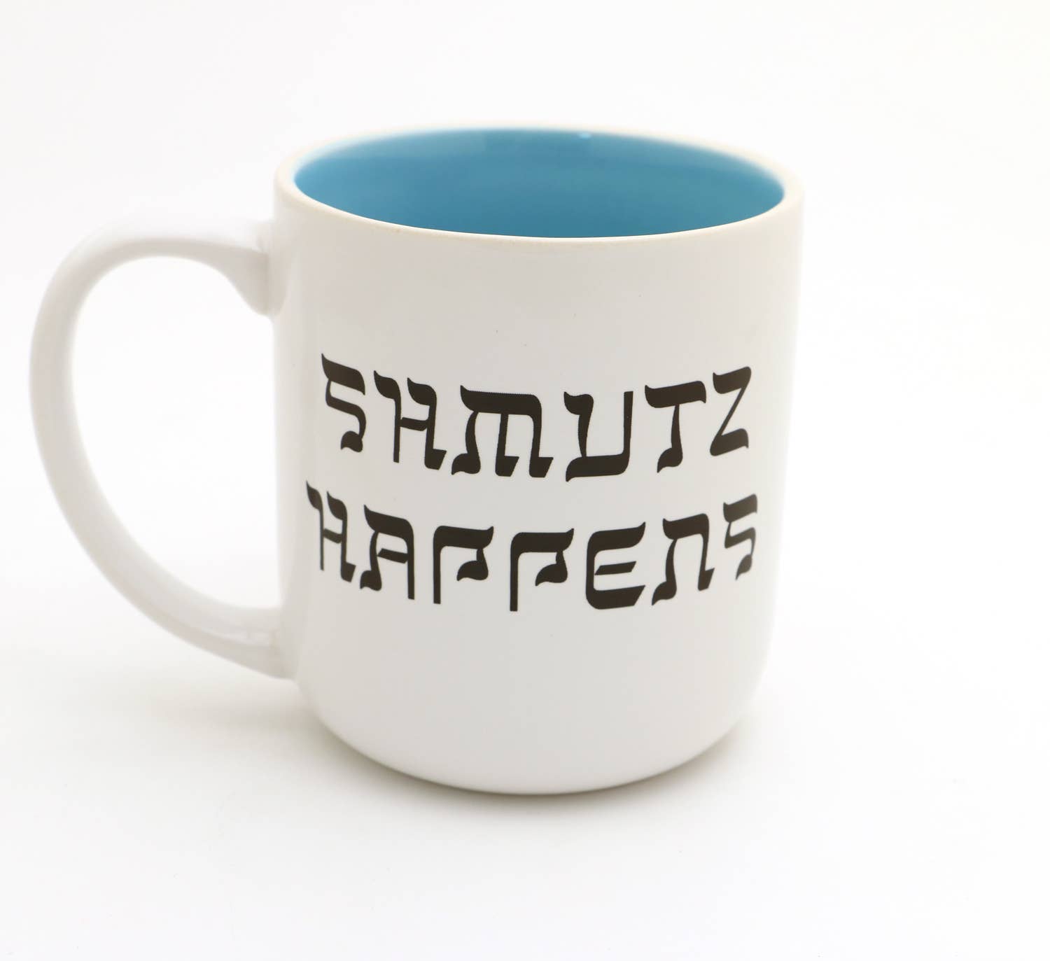White mug with blue interior and 'Shmutz Happens' text on a white background