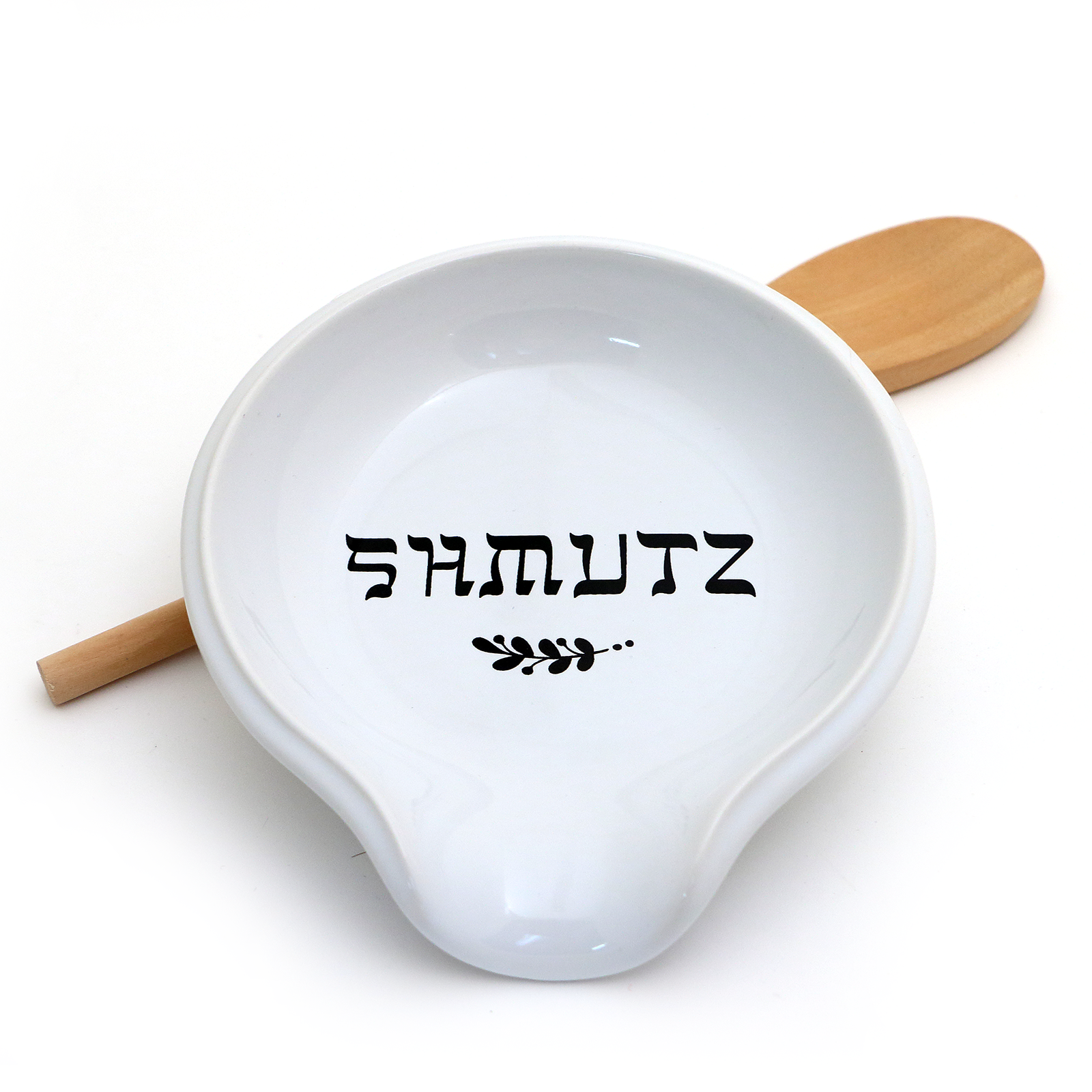 White ceramic dish with wooden handles and 'SHMUTZ' text on a white background