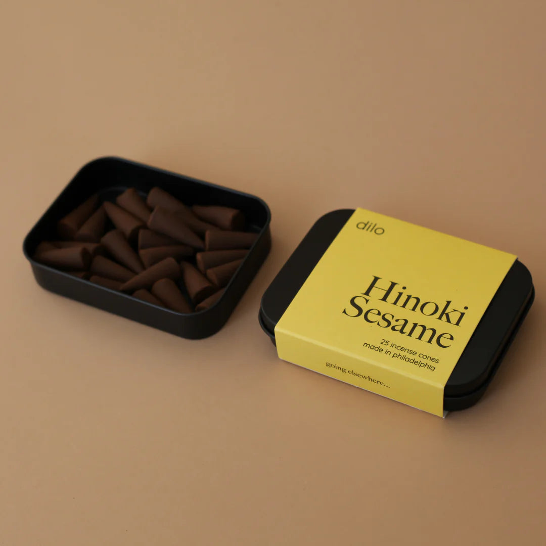 Light a cone to fill your space with coastal sea salt, smoky incense & hinoki wood. 25 cones per tin. A rich, layered scent for any space.