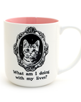 Mug with a cat illustration and text 'What am I doing with my lives?' on a white background