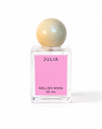 Julia perfume bottle with a cream sphere cap and pink label on a white background