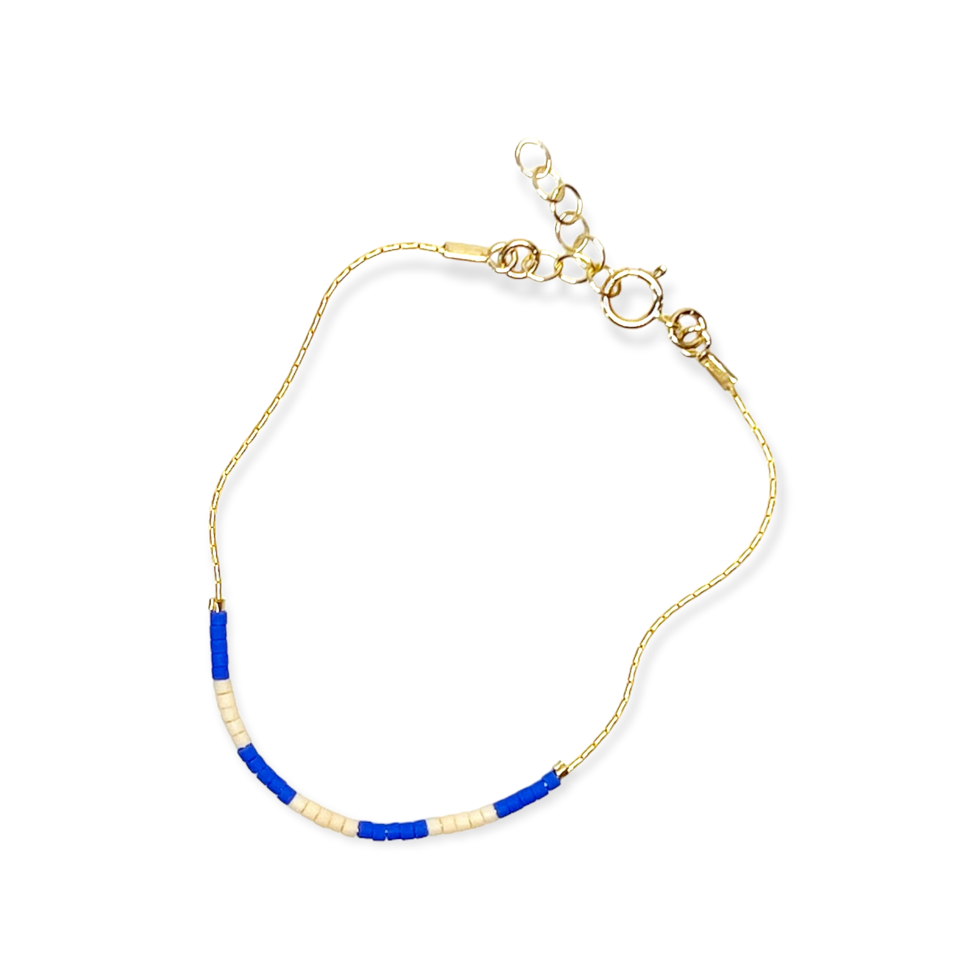 Step into a world of vibrant energy with our Kaleid Bracelet, featuring periwinkle and cream colors inspired by the beautiful Santorini coast.&nbsp;Refined Japanese glass beads are meticulously threaded onto your choice of 14k gold-filled or sterling silver chain — a match made in jewelry heaven. Both options promise a shine that withstands the test of time, ensuring your Kaleid Bracelet remains a centerpiece in your collection for decades to come.