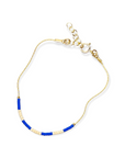 Step into a world of vibrant energy with our Kaleid Bracelet, featuring periwinkle and cream colors inspired by the beautiful Santorini coast.&nbsp;Refined Japanese glass beads are meticulously threaded onto your choice of 14k gold-filled or sterling silver chain — a match made in jewelry heaven. Both options promise a shine that withstands the test of time, ensuring your Kaleid Bracelet remains a centerpiece in your collection for decades to come.