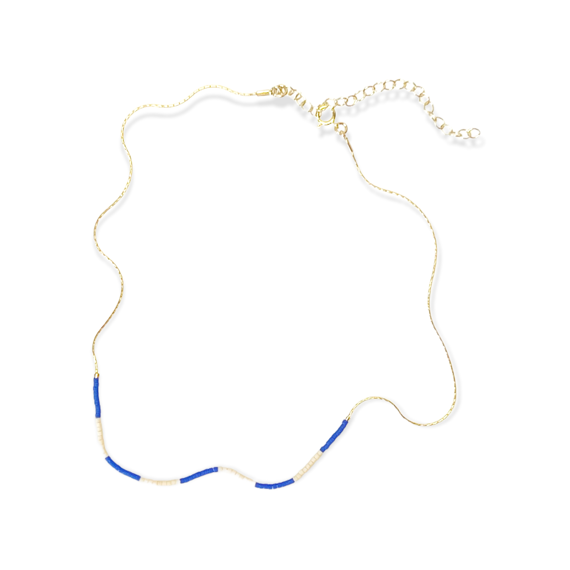 The Kaleid Necklace features an intricate hand-beaded pattern that dances in vibrant periwinkle and subdued cream. Crafted with care in our central Texas studio, the Kaleid Necklace boasts a 14k gold-filled or sterling silver chain adorned meticulously with Japanese glass beads. Each element reflects a dedication to modern luxury and artisanal precision.&nbsp;