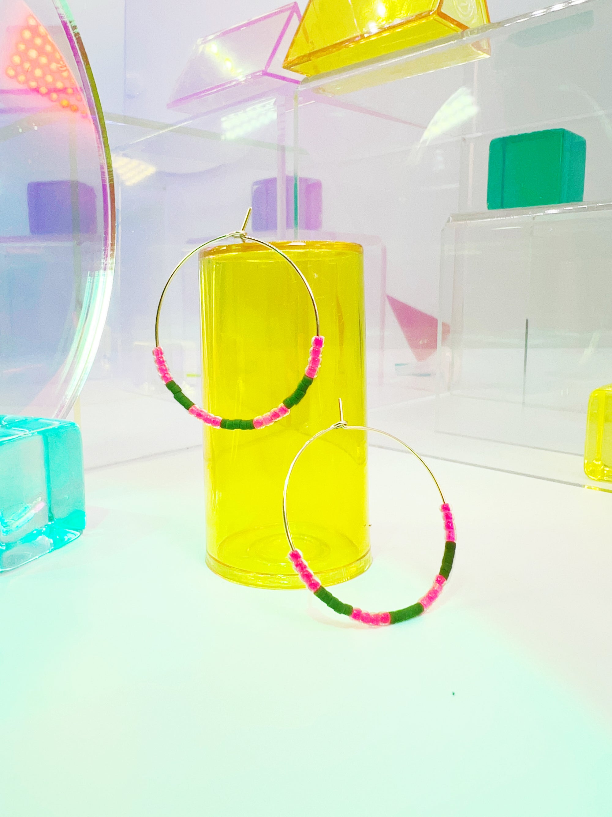 Step into a world of vibrant elegance with our Kaleid Hoops – the epitome of lightweight glamour that dances with bold colors. These hoops are more than just earrings; they're a celebration of your unique style. Prepare to make a dazzling entrance wherever you go as you flaunt the exquisite hand-beaded pattern inspired by the breathtaking colors of Santorini.